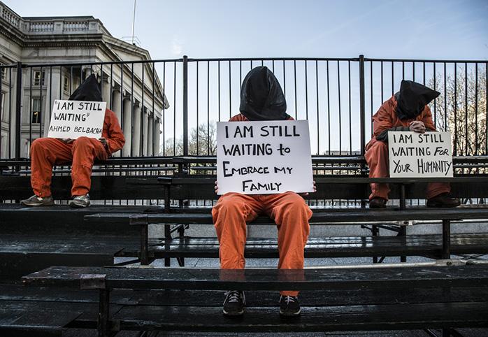 Protesters in prison garb